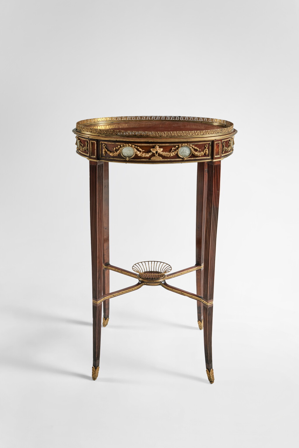 View full screen - View 1 of Lot 62. A Russian Neoclassical Gilt Bronze Mounted Fruitwood Guéridon, Circa 1790.