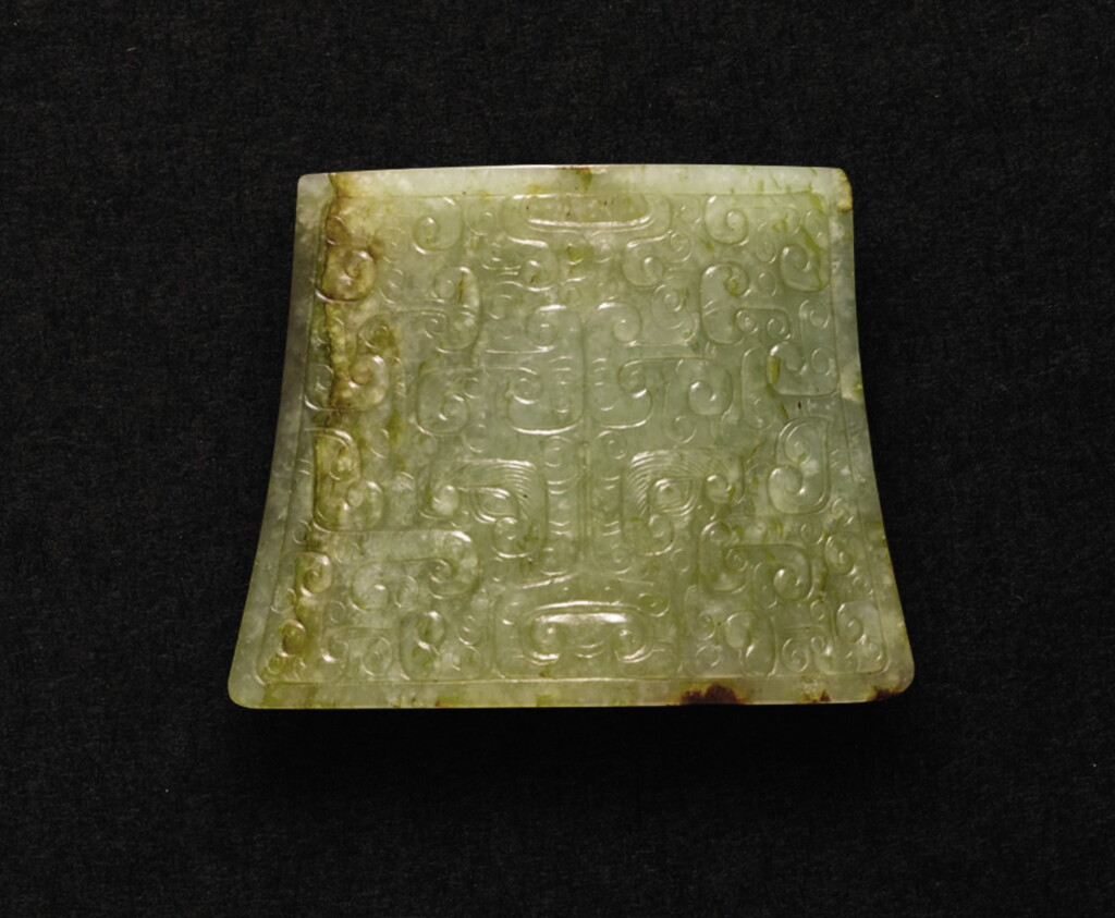 View full screen - View 1 of Lot 234. A CELADON JADE 'TAOTIE' SCABBARD CHAPE LATE EASTERN ZHOU DYNASTY - WESTERN HAN DYNASTY | 東周晚期至西漢 青玉饕餮紋劍珌.