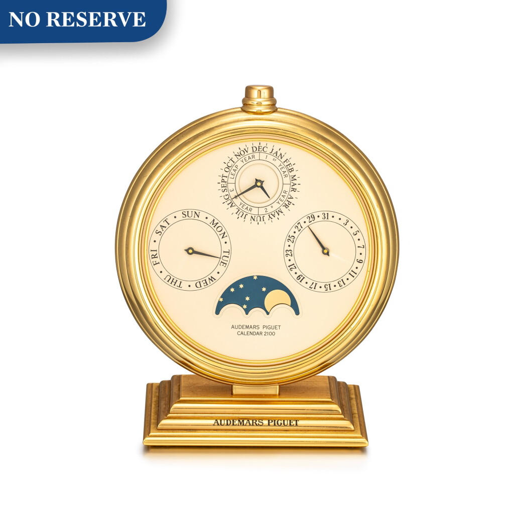 View full screen - View 1 of Lot 8118. AUDEMARS PIGUET | CALENDAR 2100 | A GILT BRASS DESK PERPETUAL CALENDAR WITH MOON-PHASES, CIRCA 1980 | 愛彼 | Calendar 2100 鍍金銅製座臺萬年曆,備月相顯示,約1980年製.