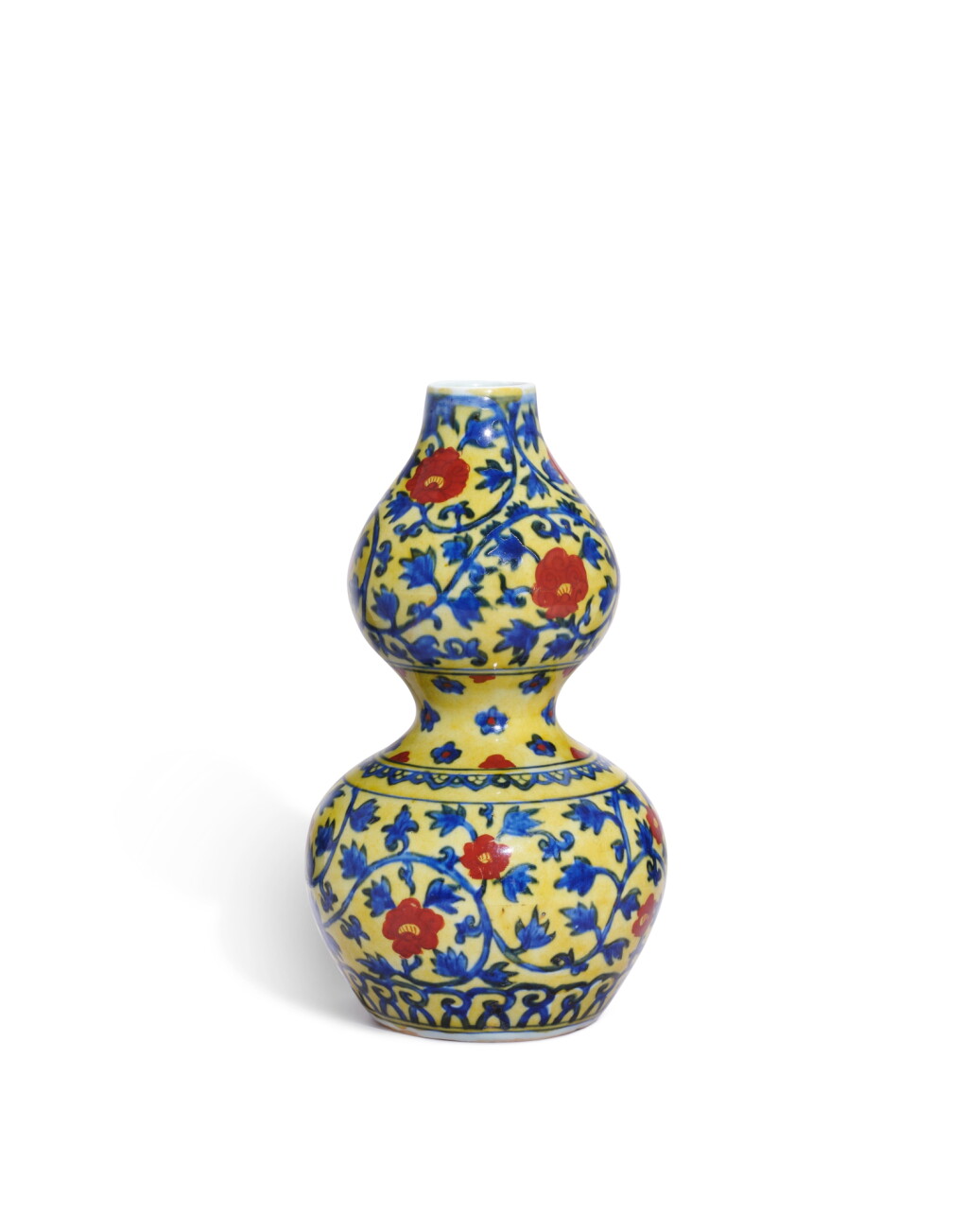 View full screen - View 1 of Lot 5054. A very rare yellow-ground underglaze-blue and iron-red 'peony' double gourd vase, Mark and period of Jiajing | 明嘉靖 黃地青花加礬紅彩纏枝牡丹紋葫蘆瓶 《大明嘉靖年製》款.