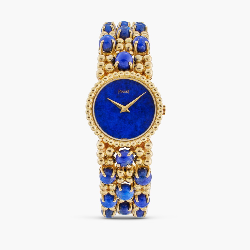 View full screen - View 1 of Lot 346. Reference 924P 11 | A yellow gold and lapis lazuli bracelet watch, Circa 1980.