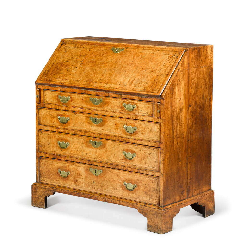 View full screen - View 1 of Lot 42. A George II burr walnut and walnut feather-banded bureau, second quarter 18th century.