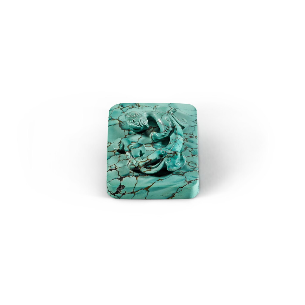 View full screen - View 1 of Lot 45. A small uncarved turquoise seal Late Qing dynasty | 清末 綠松石雕螭龍紋印.