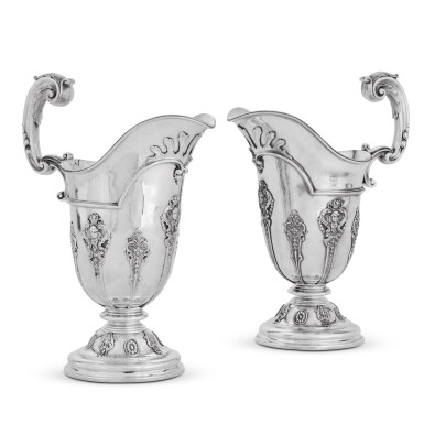 View full screen - View 1 of Lot 172. A pair of Victorian silver ewers, Goldsmiths Company Ltd., London, 1900 and Edward Barnard & Sons, London, 1900.