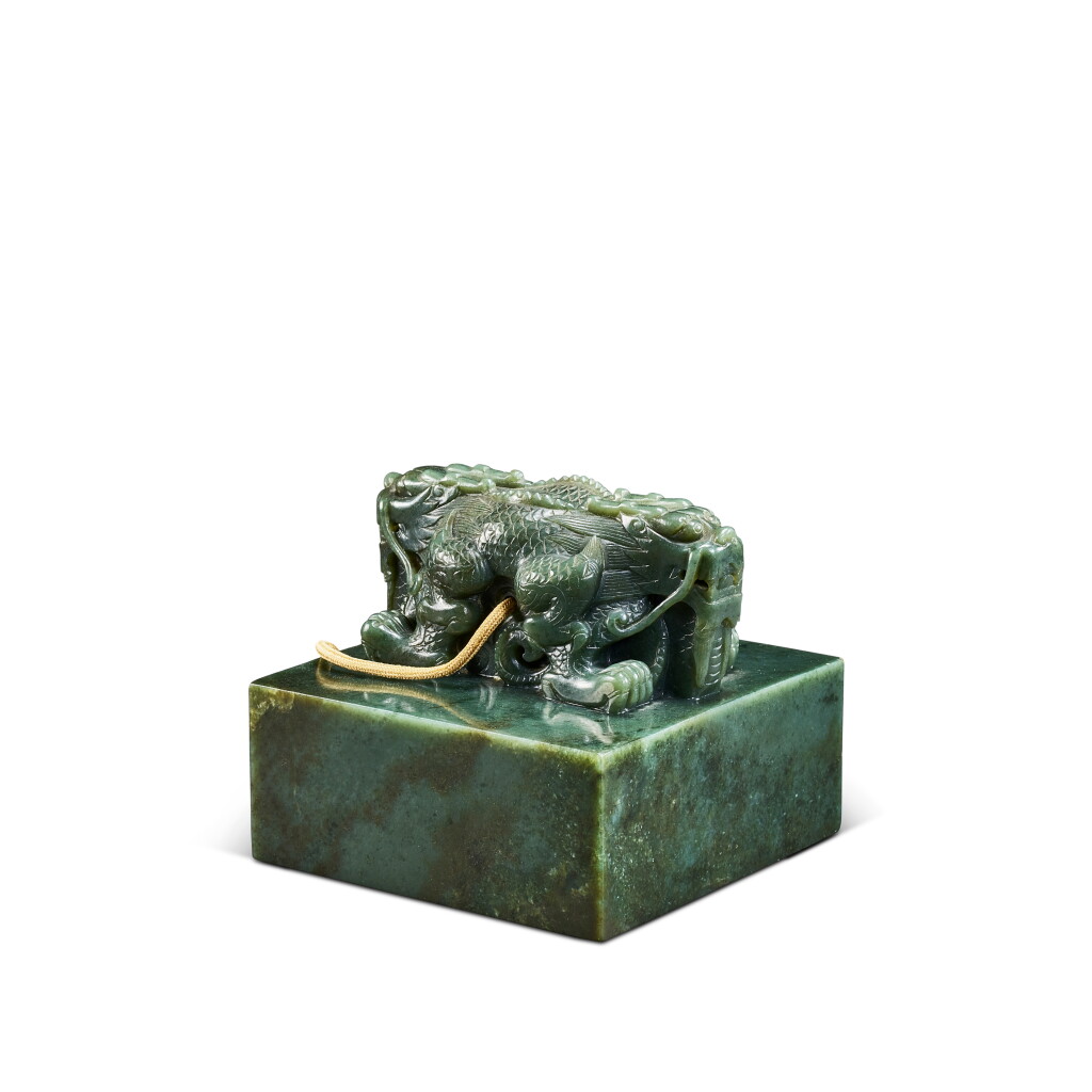 View full screen - View 1 of Lot 608. An Imperial green jade 'dragon' posthumous seal for the Empress Dowager Ci'an, The carving: Qing dynasty, Qianlong period, The seal face: Qing dynasty, Guangxu period, 1881 | 玉寶:清乾隆 印文:清光緒 1881年 青玉孝貞顯皇后玉寶.