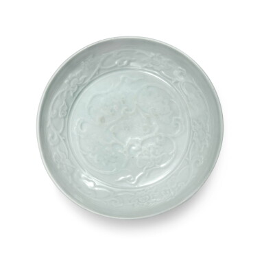 View full screen - View 1 of Lot 91. A molded 'Shufu' white-glazed 'lotus' dish, Yuan dynasty | 元 樞府白釉印花纏枝蓮紋盤.