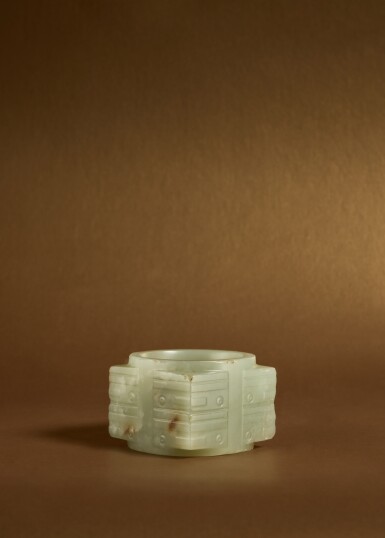 View full screen - View 1 of Lot 102. An archaic pale green jade ‘mask’ cong, Shang dynasty or later.