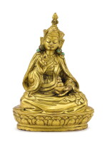 A GILT-BRONZE FIGURE OF PADMASAMBHAVA, TIBET, 18TH CENTURY | 十八世紀 藏傳鎏金銅蓮花生大師坐像