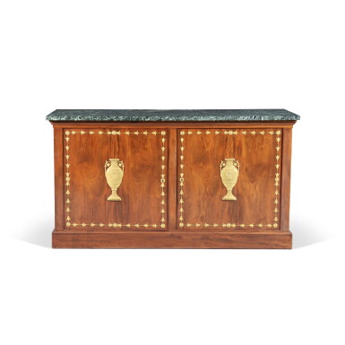 View full screen - View 1 of Lot 258. A gilt-bronze mounted mahogany commode, Empire, circa 1810 | Commode à vantaux en acajou et monture de bronze doré d'époque Empire, vers 1810.