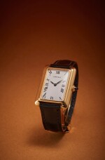 Stepped Tank | New York retailed: A yellow gold rectangular wristwatch with triple-stepped sides and original gold deployant buckle, Circa 1970