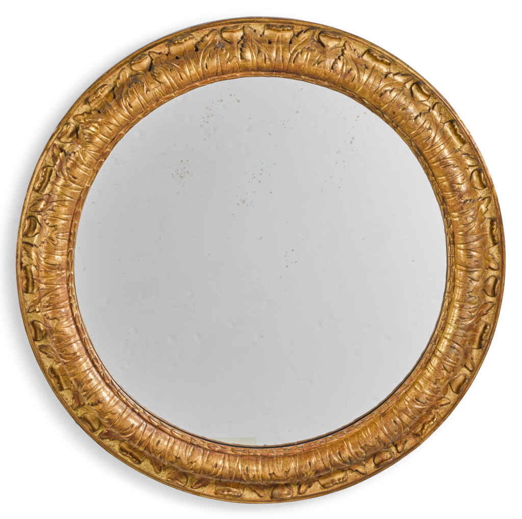View full screen - View 1 of Lot 186. A CONTINENTAL CIRCULAR CARVED GILTWOOD WALL MIRROR 19TH CENTURY.