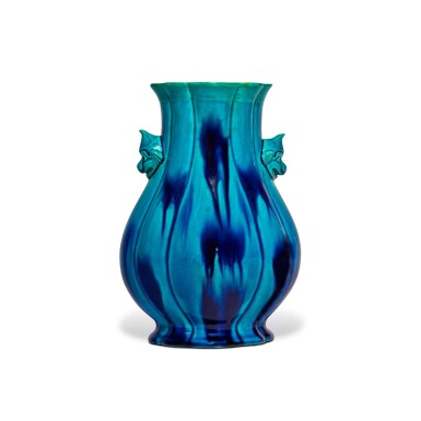 View full screen - View 1 of Lot 1117. An archaistic turquoise-glazed hu-form vase, Qing dynasty, 18th / 19th century | 清十八 / 十九世紀 孔雀藍釉仿古獸首耳壺.