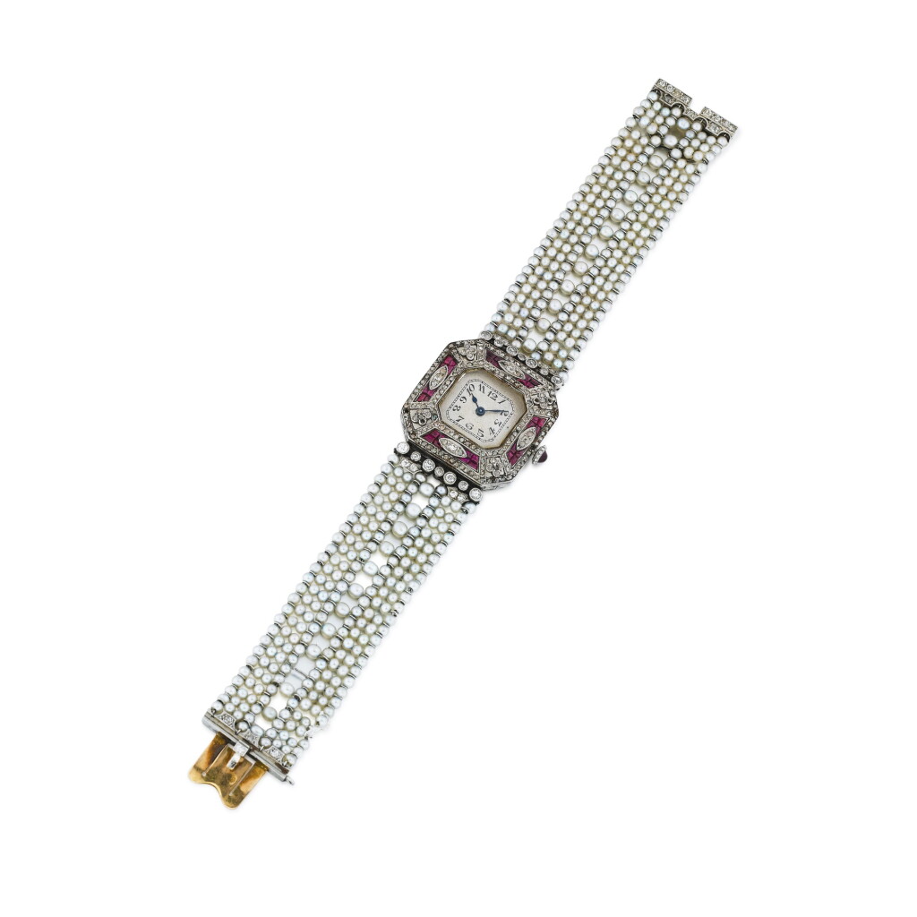 View full screen - View 1 of Lot 181. Montre bracelet de dame perles semence, rubis et diamants | Lady's seed pearl, ruby and diamond bracelet watch.