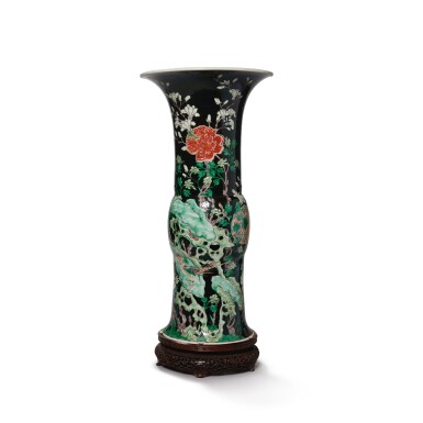 View full screen - View 1 of Lot 631. A famille-noire 'bird and flower' beaker vase, the porcelain 18th century, the enamels later-added | 清十八世紀 後加彩墨地五彩錦堂富貴圖花觚.