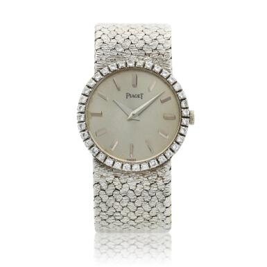 View full screen - View 1 of Lot 83. Reference 9159 A white gold and diamond-set bracelet watch, Circa 1970 .