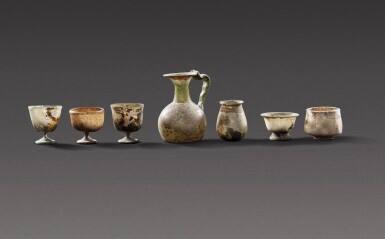 View full screen - View 1 of Lot 126. Seven Glass Vessels, circa 3rd/5th century A.D..
