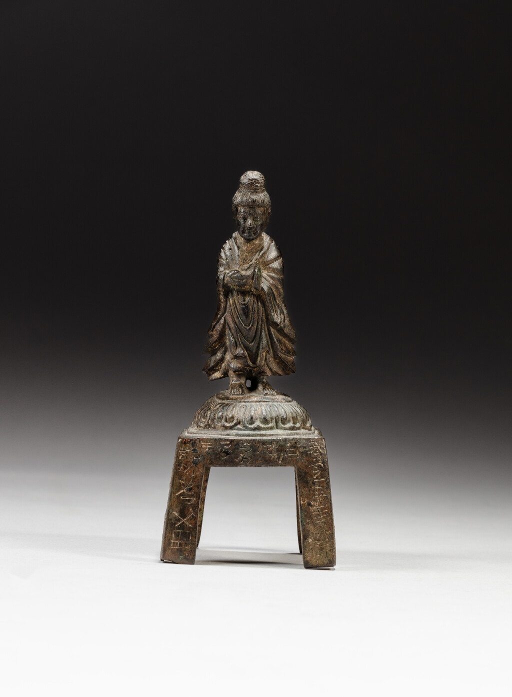 View full screen - View 1 of Lot 58. An inscribed bronze figure of a Bodhisattva, Late Eastern Wei dynasty, dated to the fifth year of the Wuding Period (corresponding to 547) | 東魏末 武定五年(547年)銅菩薩立像.
