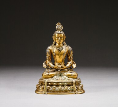 View full screen - View 1 of Lot 101. A gilt-bronze figure of Amitayus, Qing dynasty, 17th-18th century | 清十七至十八世紀 鎏金銅無量壽佛坐像.