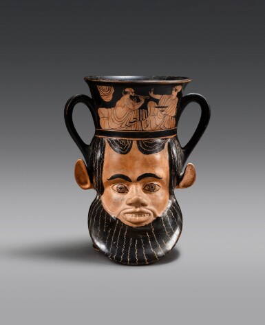 View full screen - View 1 of Lot 17. An Attic Red-Figured Janiform Kantharos, attributed to the Syriskos Painter, circa 480-470 B.C..