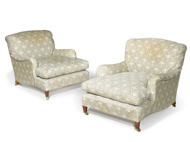 View full screen - View 1 of Lot 104. A pair of Edwardian mahogany 'Ivor' easy armchairs by Howard & Sons, circa 1910.