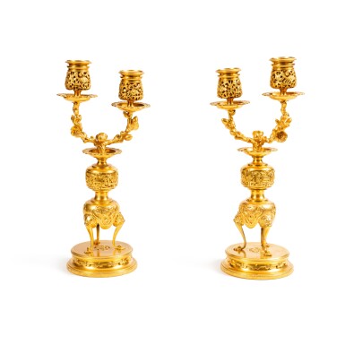 View full screen - View 1 of Lot 234. A pair of two-light gilt-bronze candelabra, circa 1880, signed by Ferdinand Barbedienne, the model attributed to Edouard Lievre | Paire de candélabres à deux lumières en bronze doré, vers 1880, signés Ferdinand Barbedienne, le modèle attribué à Edouard Lièvre.