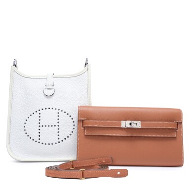 View full screen - View 1 of Lot 132. Set of Two: Gold Epsom Kelly-To-Go Wallet Palladium Hardware, 2024 and White Clémence Mini Evelyne Palladium Hardware, 2024.