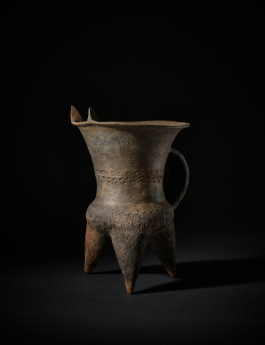 View full screen - View 1 of Lot 206. A rare archaic gray pottery tripod wine vessel (Gui), Early Shang dynasty, Erlitou culture | 商初 二里頭文化 灰陶鬶.