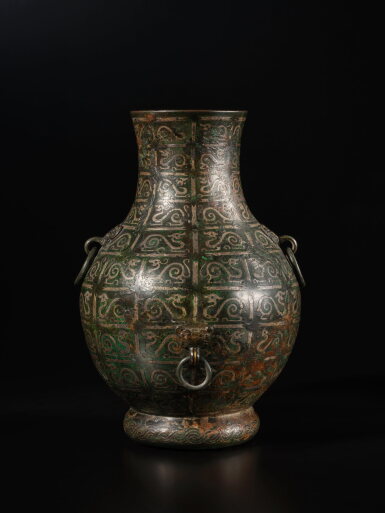 View full screen - View 1 of Lot 332. An archaistic gold and silver-inlaid bronze Hu-form vase, Song dynasty | 宋 銅錯金銀龍紋壺.