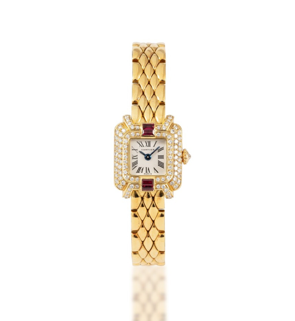 View full screen - View 1 of Lot 498. Cartier | Montre bracelet de dame or rubis et diamants | Lady's gold ruby and diamond bracelet watch.