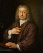 ABRAHAM CARREE | Portrait of a gentleman, half-length, seated at a table with a crucifix, his hand resting on a Bible