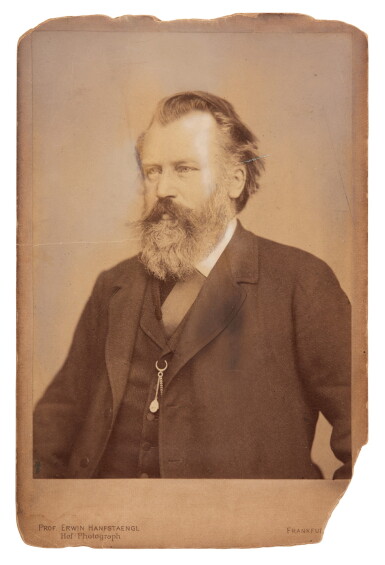 View full screen - View 1 of Lot 31. J. Brahms. Photograph inscribed and signed with a musical representation of Helene von Heldburg's initials, 1895.