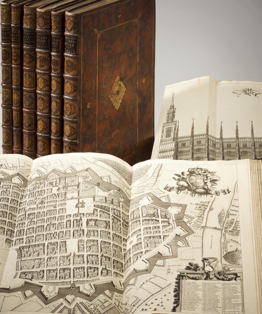 View full screen - View 1 of Lot 49. Blaeu, Nieuw Stedeboeck van Italien (Piemont), The Hague, 1724-1725, 8 volumes, marbled calf gilt.