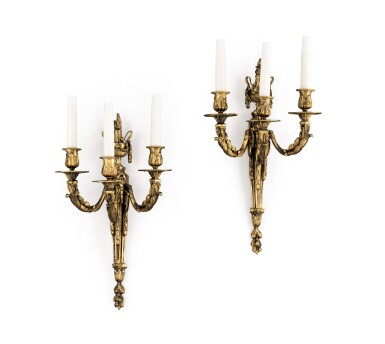 View full screen - View 1 of Lot 125. A pair of Louis XVI style three-branch gilded brass wall lights,.