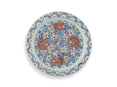 View full screen - View 1 of Lot 2171. A rare underglaze-blue and copper-red-decorated 'carp’ charger, Mark and period of Kangxi | 清康熙 青花釉裏紅魚紋折沿大盤 《大清康熙年製》款.