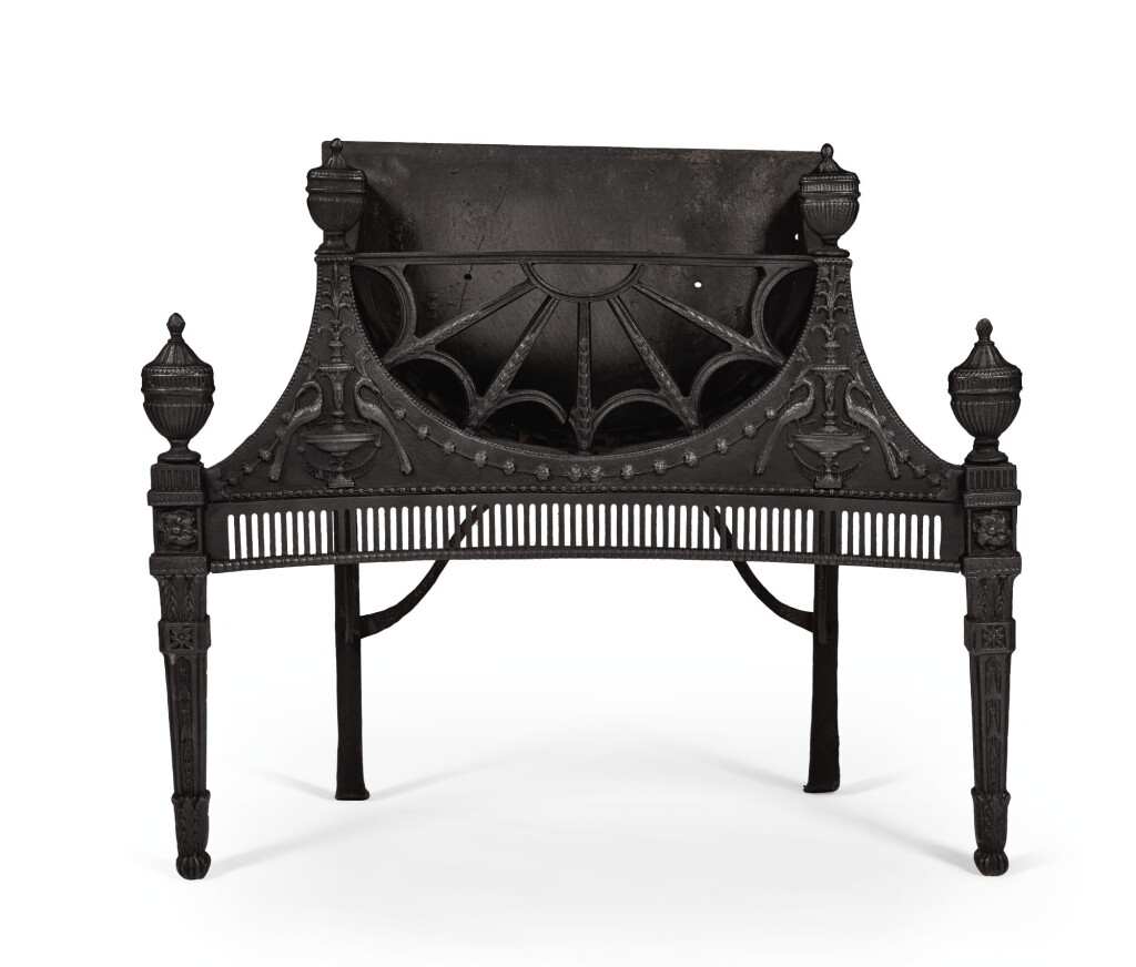 View full screen - View 1 of Lot 50. A GEORGE III CAST-IRON CONCAVE FIRE GRATE, LAST QUARTER 18TH CENTURY, ATTRIBUTED TO THE CARRON IRONWORKS IN FALKIRK.