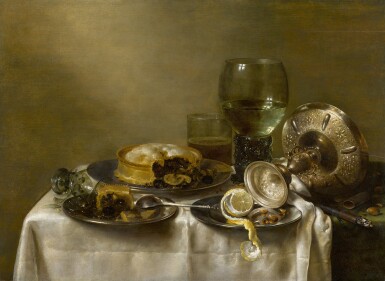 View full screen - View 1 of Lot 11. A still life with an overturned silver tazza, glassware, pies and a peeled lemon on a table |《靜物:桌上倒轉的銀製扁花瓶、玻璃器皿、餡餅和去皮檸檬》.