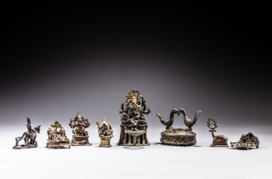 View full screen - View 1 of Lot 89. A group of eight copper-alloy and gilt-copper alloy figures of deities, Essentially India, 14th / 18th century | 印度及其他 十四 /十八世紀 合金銅及銅合金鎏金神像一組八件.