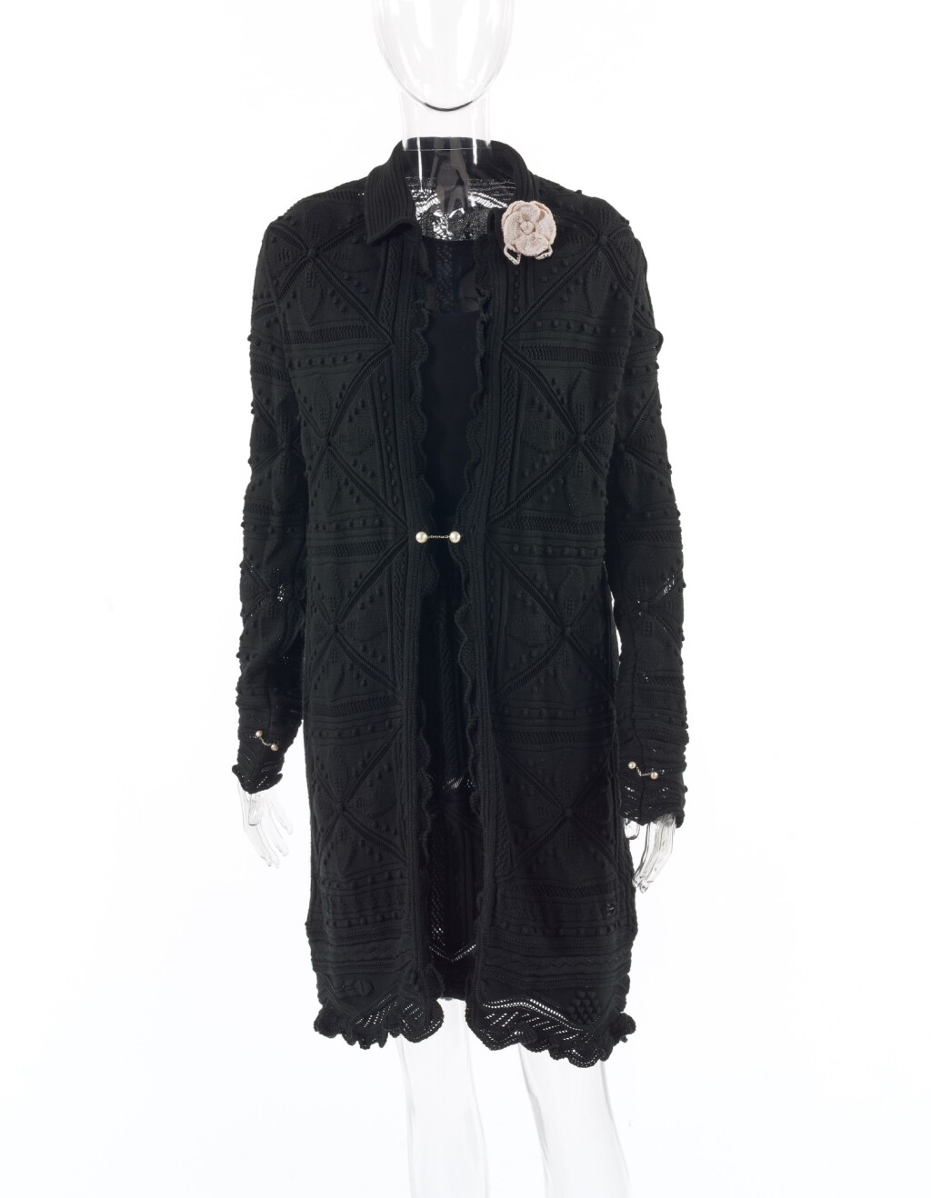 View full screen - View 1 of Lot 75. CHANEL | BLACK COTTON-KNIT CARDIGAN COAT AND SKIRT WITH CAMELLIA BROOCH .