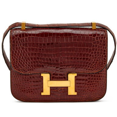 View full screen - View 1 of Lot 103. Vintage Miel Shiny Niloticus Crocodile Constance 24 Gold Hardware, 1985.