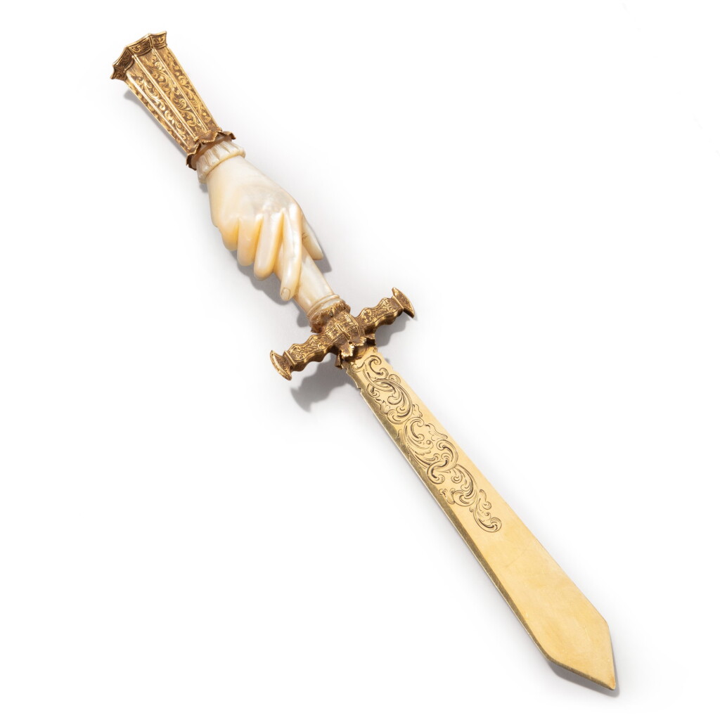 View full screen - View 1 of Lot 1134. A letter-opener with gold-mounted mother-of-pearl, Continental, 19th century.