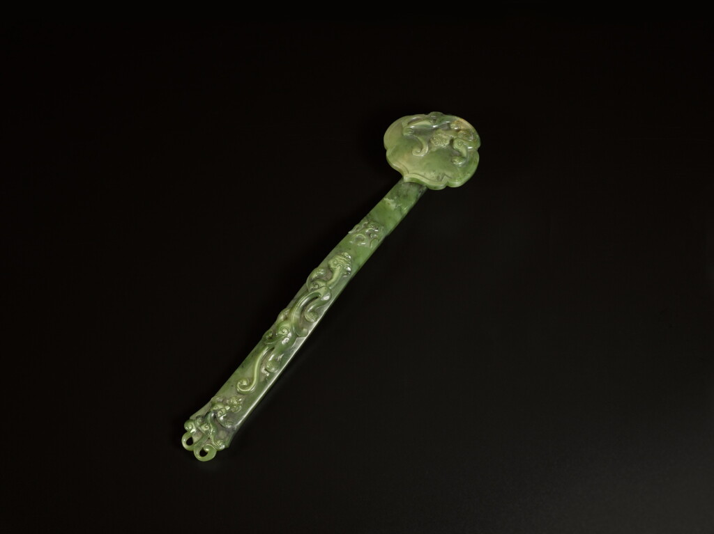 View full screen - View 1 of Lot 91. A spinach-green jade ruyi scepter, Qing dynasty, 18th / 19th century.