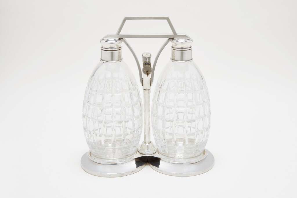 View full screen - View 1 of Lot 57. A PAIR OF SILVER-MOUNTED CUT-GLASS DECANTERS | T.G. HAWKES & CO., CORNING, NY | CIRCA 1920'S.