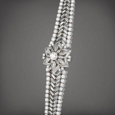 View full screen - View 1 of Lot 113. Reference 3215 | Retailed by Serpico y Laino: A platinum and diamond-set concealed bracelet watch, Made in 1957.