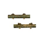 A pair of bronze 'tiger and dragon' chariot fittings, Western Zhou dynasty 西周 青銅龍紋獸首車馬飾一對