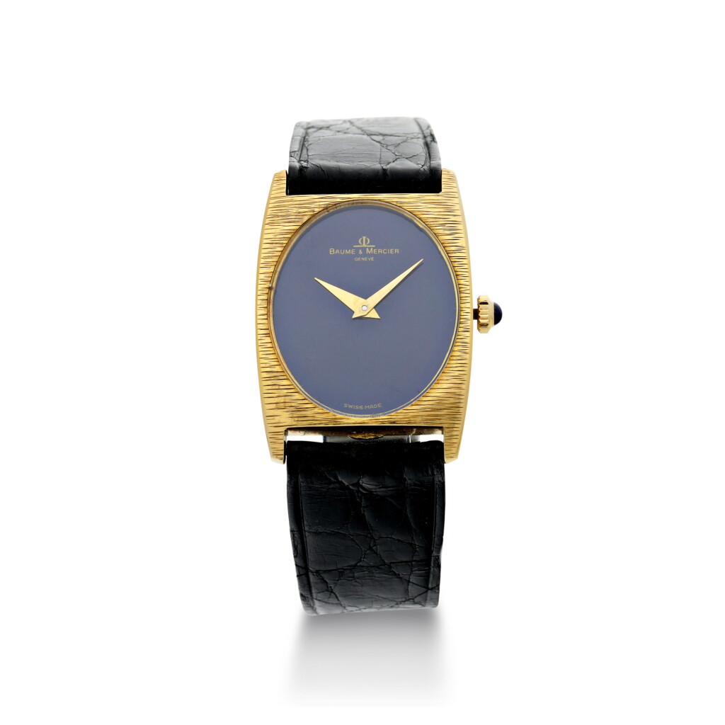 View full screen - View 1 of Lot 1056. REFERENCE 37073 A YELLOW GOLD OVAL WRISTWATCH WITH LAPIS LAZULI DIAL, CIRCA 1980.