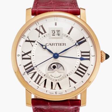 View full screen - View 1 of Lot 540. Reference W1556220 Rotonde De Cartier | A pink gold automatic dual time wristwatch with date and day/night indication, Circa 2015.