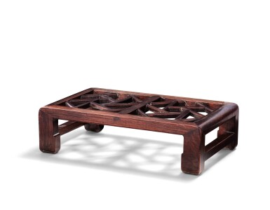View full screen - View 1 of Lot 33. A hongmu and huali openwork 'crackled ice' footrest Qing dynasty, 19th century | 清十九世紀 花梨木嵌紅木冰裂紋腳踏.