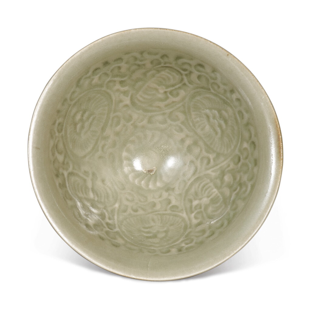 View full screen - View 1 of Lot 536. A small molded 'Yaozhou' celadon-glazed 'chrysanthemum' conical bowl, Northern Song / Jin dynasty.