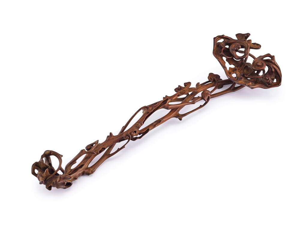 View full screen - View 1 of Lot 2154. A boxwood reticulated ruyi sceptre Qing dynasty | 清 黃楊木鏤雕瑞芝如意.