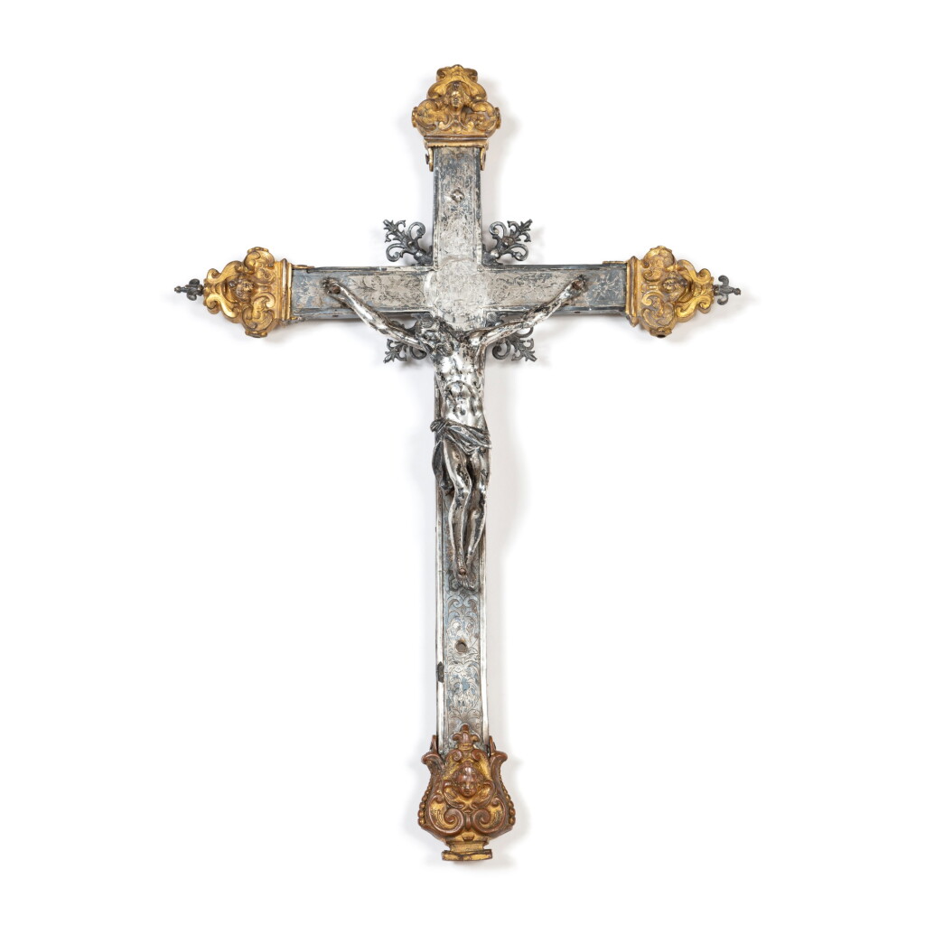View full screen - View 1 of Lot 115. A silver and gilt bronze processional cross on wooden core, probably southern Italy, circa 1740 | Croix de procession en argent et bronze doré sur âme en bois, probablement Italie du Sud, vers 1740.